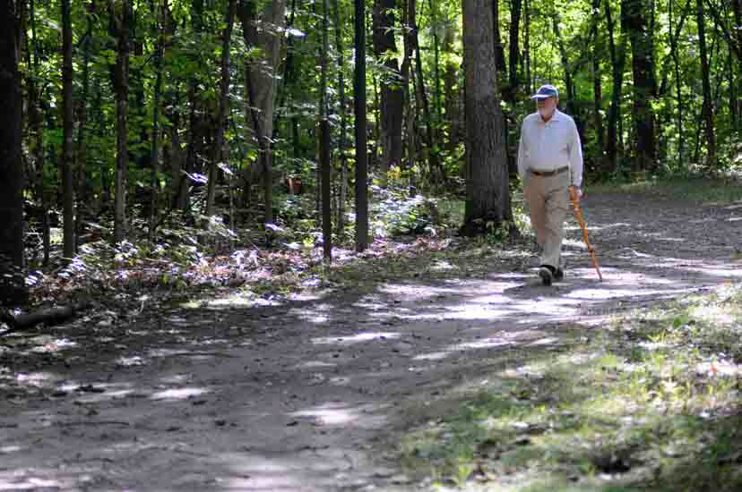 Man walking on wooded trail