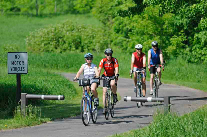 Group of bikers on paved trail
