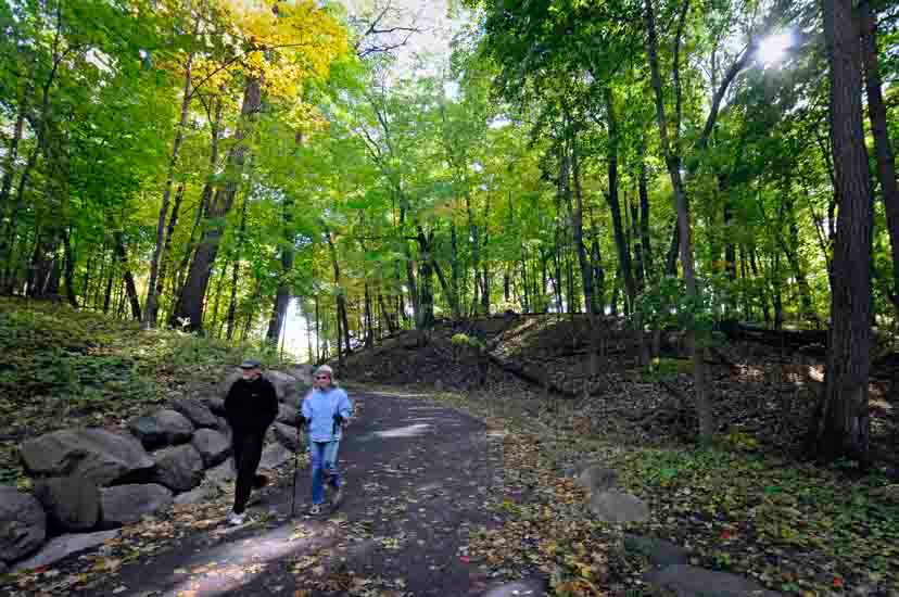 Couple hiking wooded trail