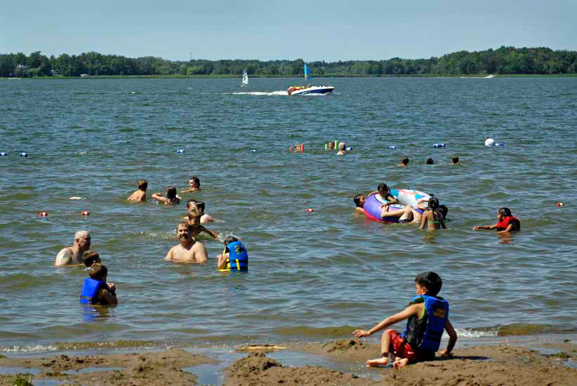Children swimming in lake
