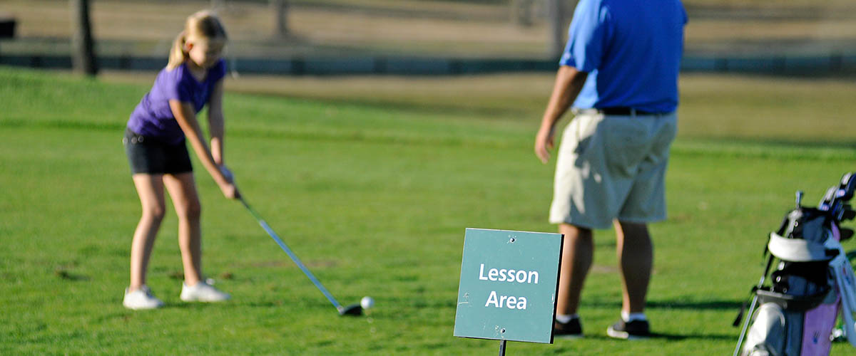 Young golfer in lesson