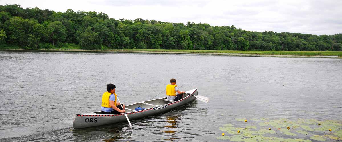 Children paddling a canoe