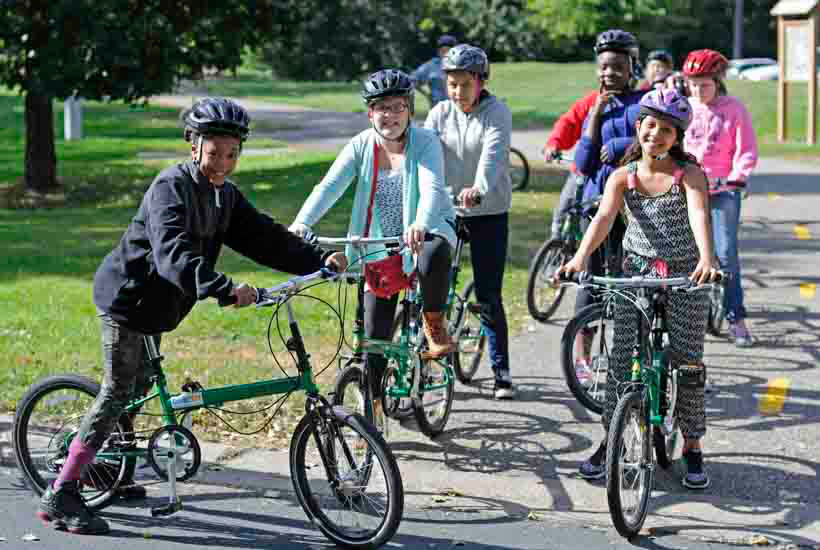 Groups of kids on paved bike trail