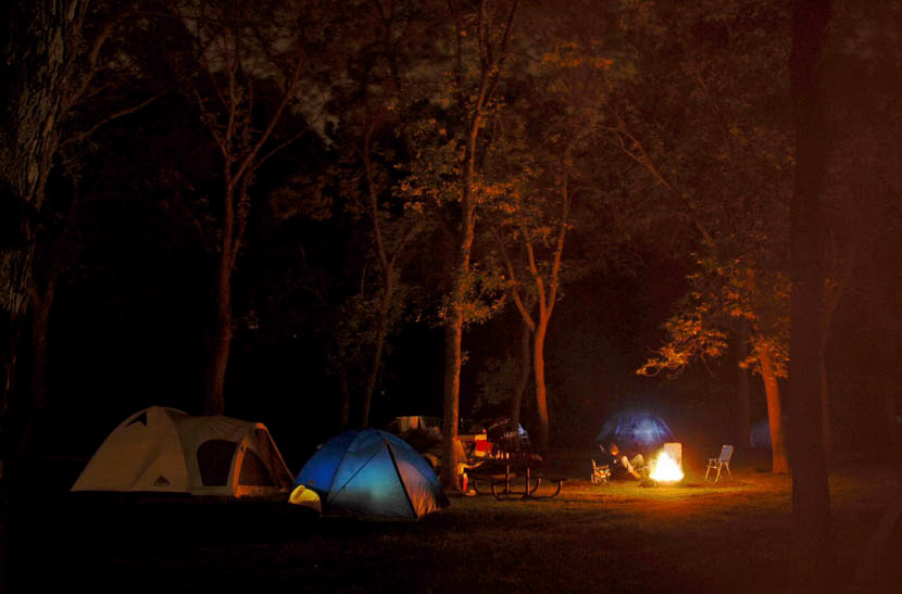 Campfire and tents at night