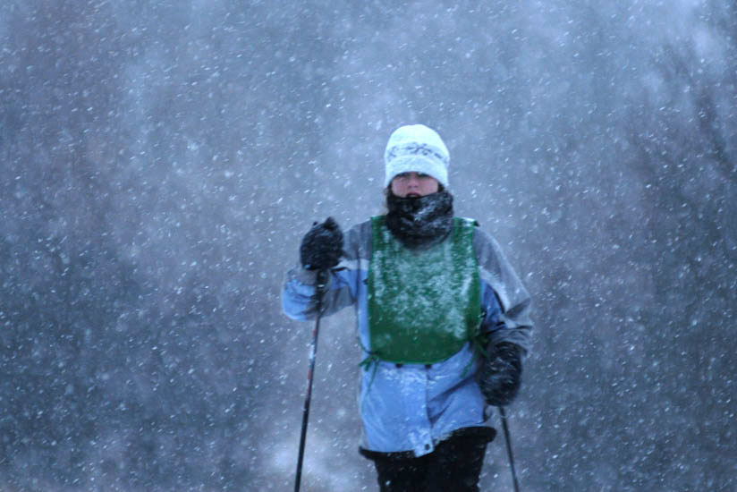 Cross-country skier in falling snow