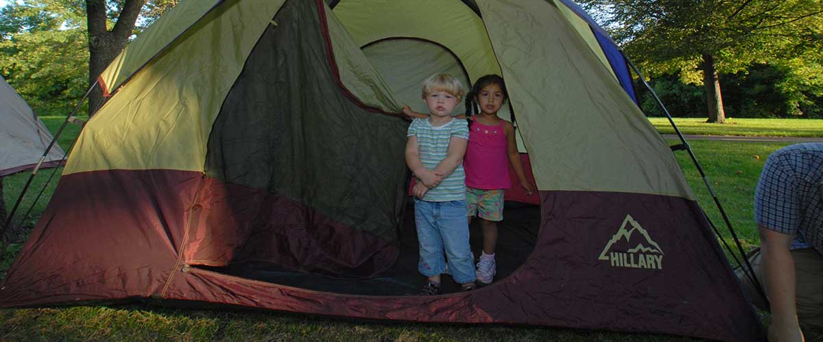 Children in door of tent
