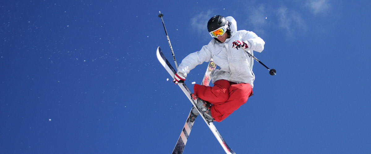 Skier mule kicking in the air