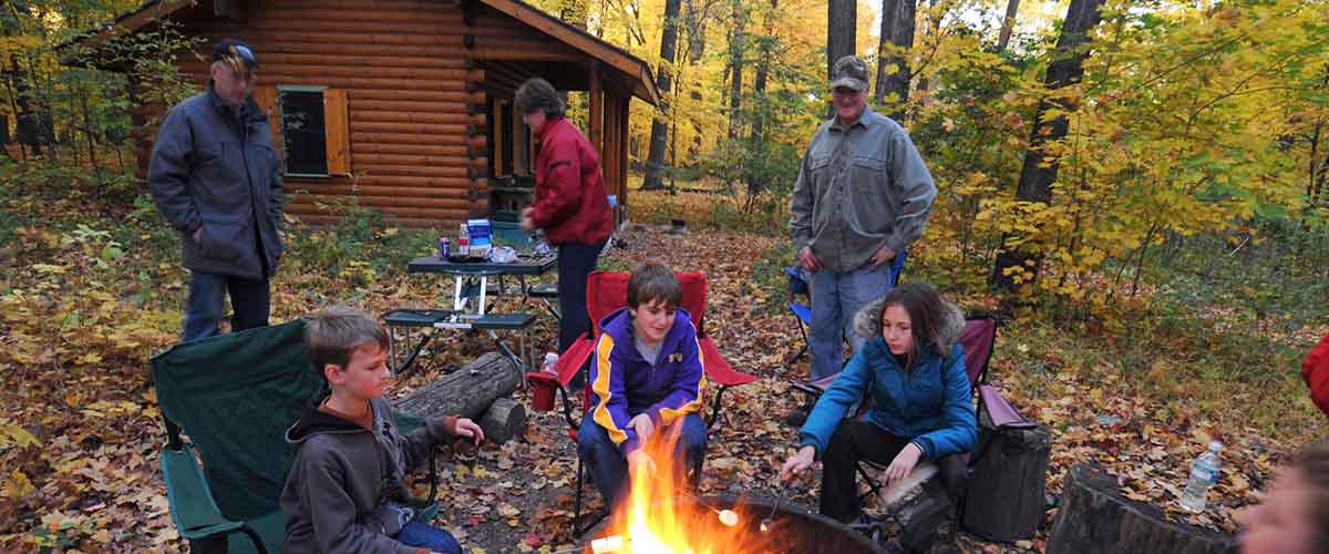 a family around a campfire