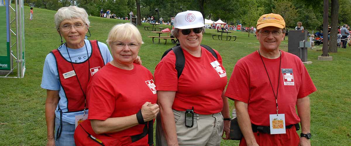 four women in volunteer shirts