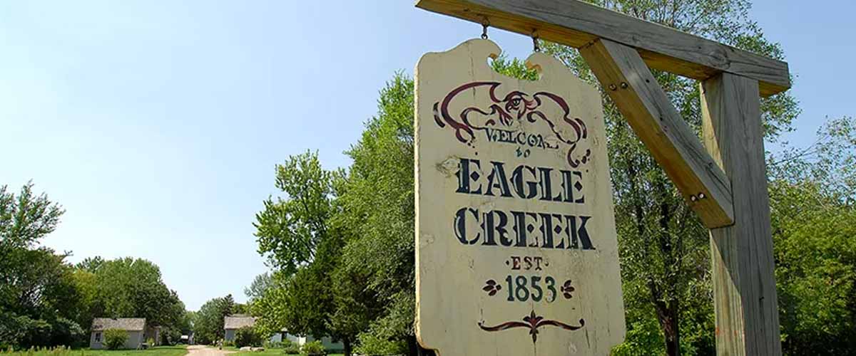An old-fashioned sign with "eagle creek" written on it
