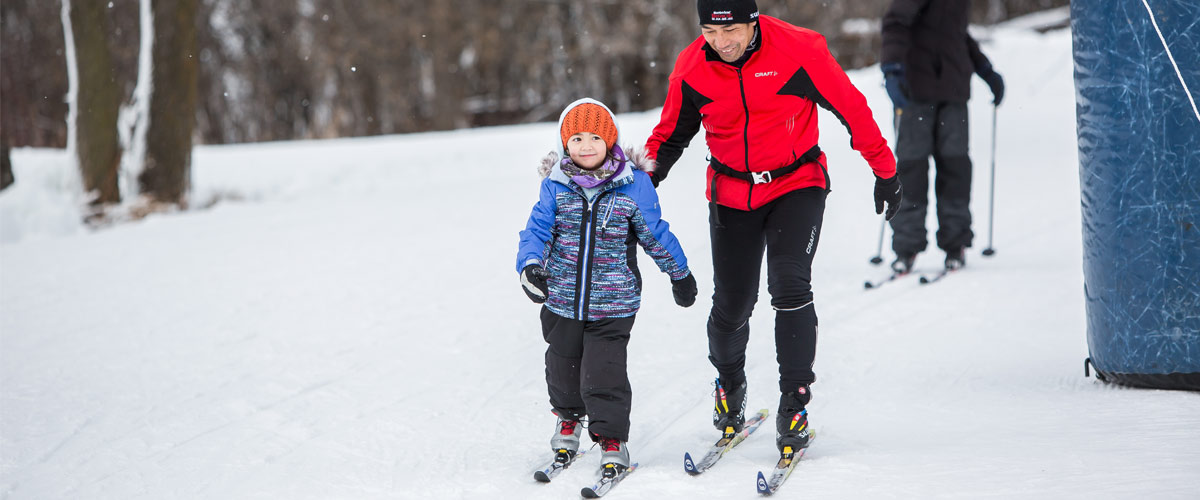 Dad and daughter cross-country skiing 