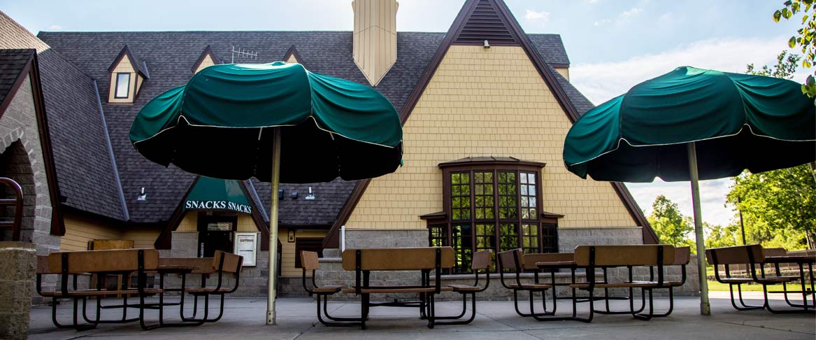 hyland visitor center with picnic tables and umbrellas