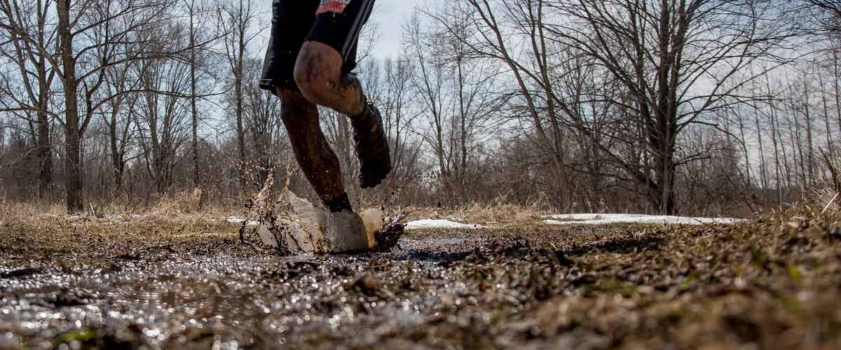 Running on a muddy trail