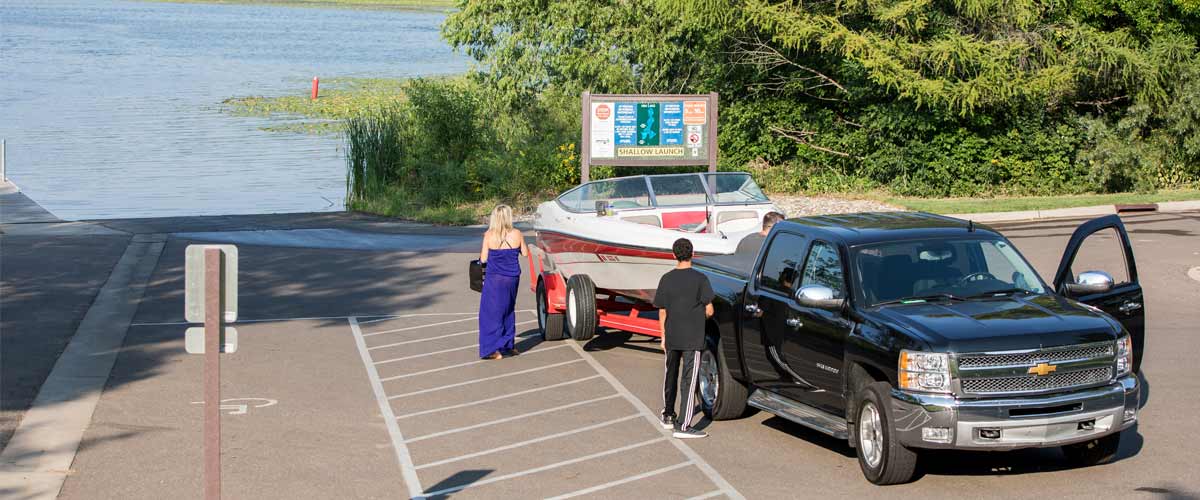 a truck pulled up to a boat launch