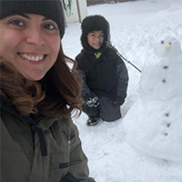 jenifer garcia and her nephew building a snowman