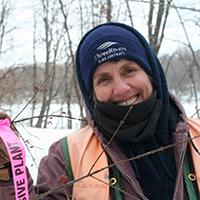 Missy Anderson in winter at an invasive species removal event