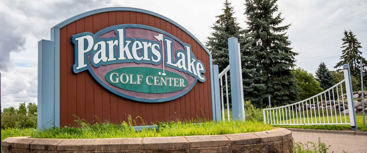 A sign at a golf course entrance reads Parkers Lake Golf Center.