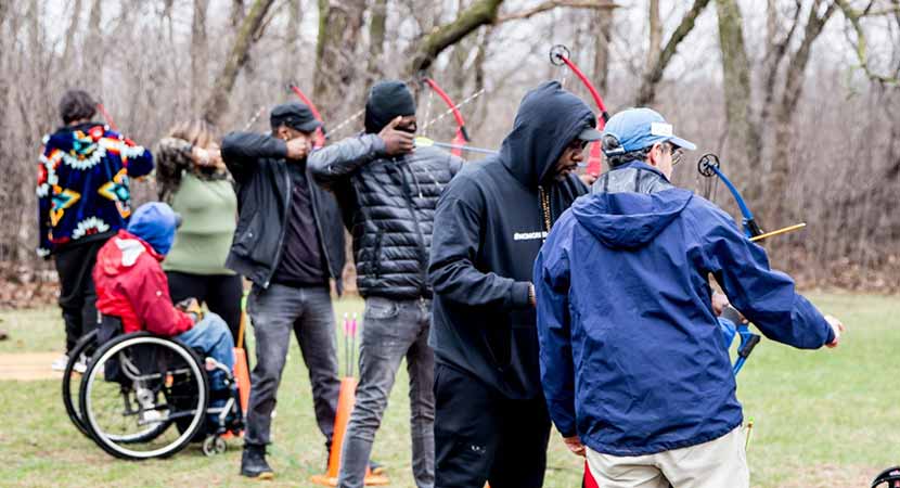 Participants learned archery at Mississippi Gateway Regional Park at an archery and biking program in April 2022. Farji is second from the right.