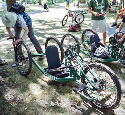 A handcycle is prepared for a race with air to the tires.