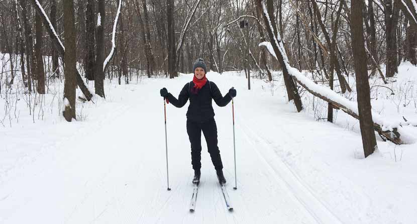 erin cross-country skiing through the woods