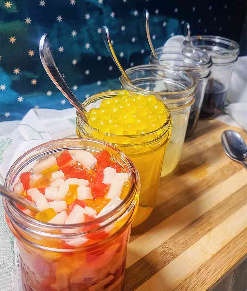 tri color jellies and mango pearls in mason jars