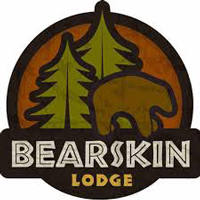 Bearskin Lodge logo with a graphic of a brown bear with two evergreen trees behind it on an orange circle.