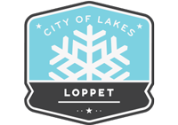 City of Lakes Loppet logo, with a white snowflake on a light blue background between "City of Lakes" and "Loppet"